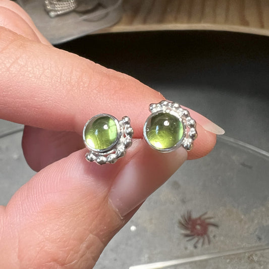 Holding Large Peridot Birthstone Stud Earrings