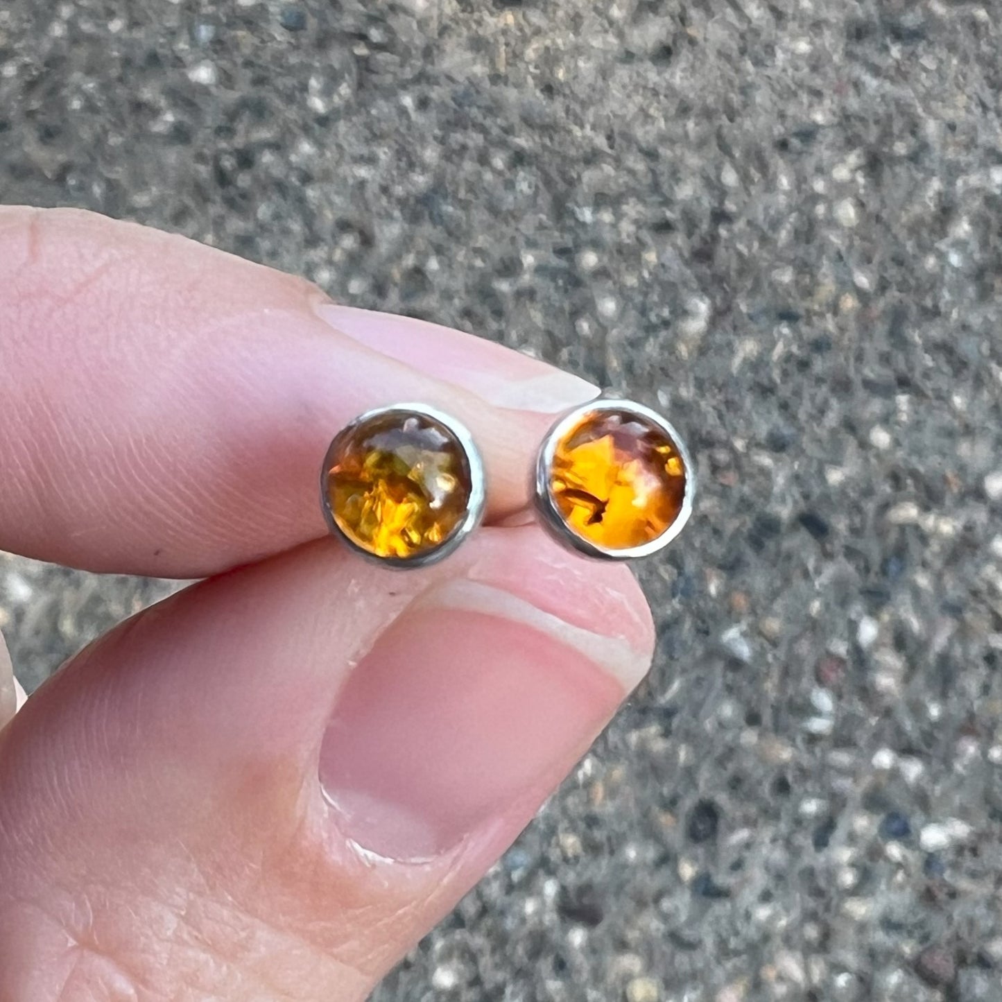 Woman holding Amber Earrings in Sterling Silver