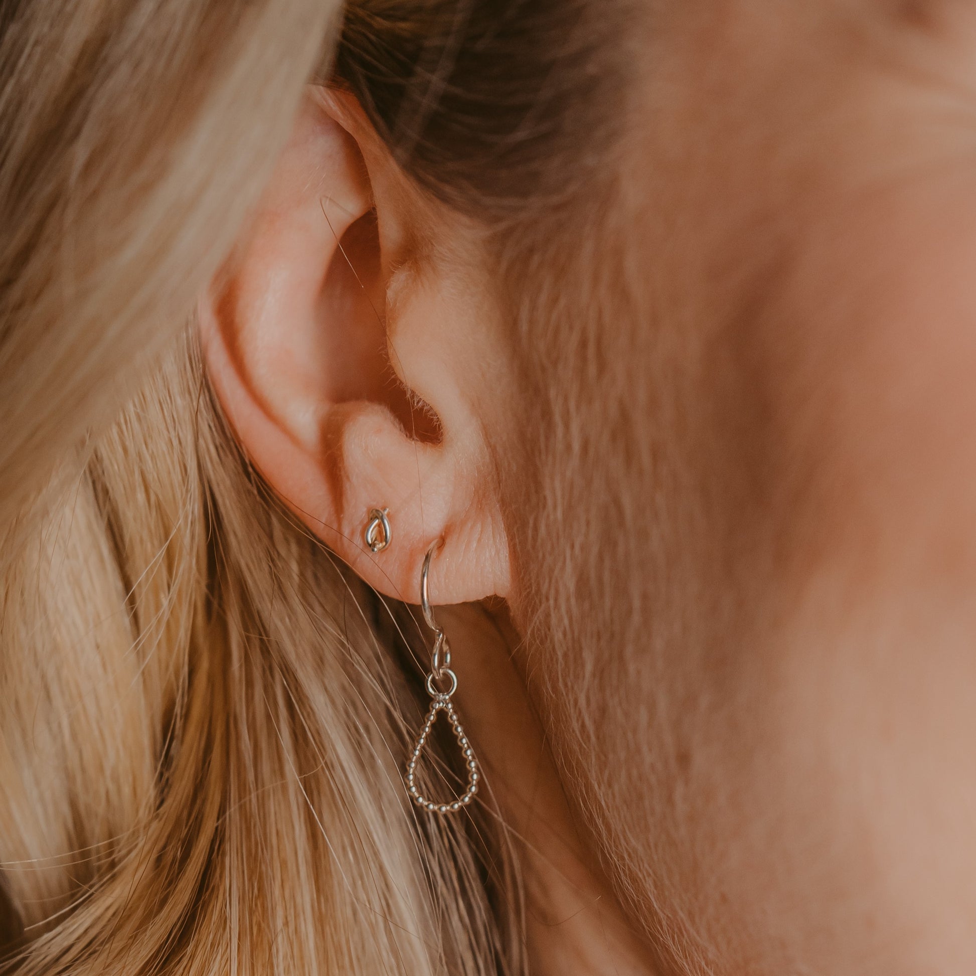 Woman wearing Silver Knot Earrings - Trisha Flanagan