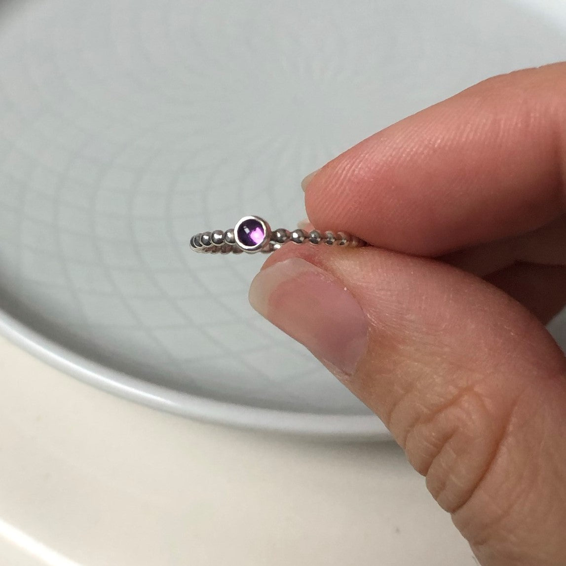 Woman holding a Mini Amethyst Silver Ring - Trisha Flanagan