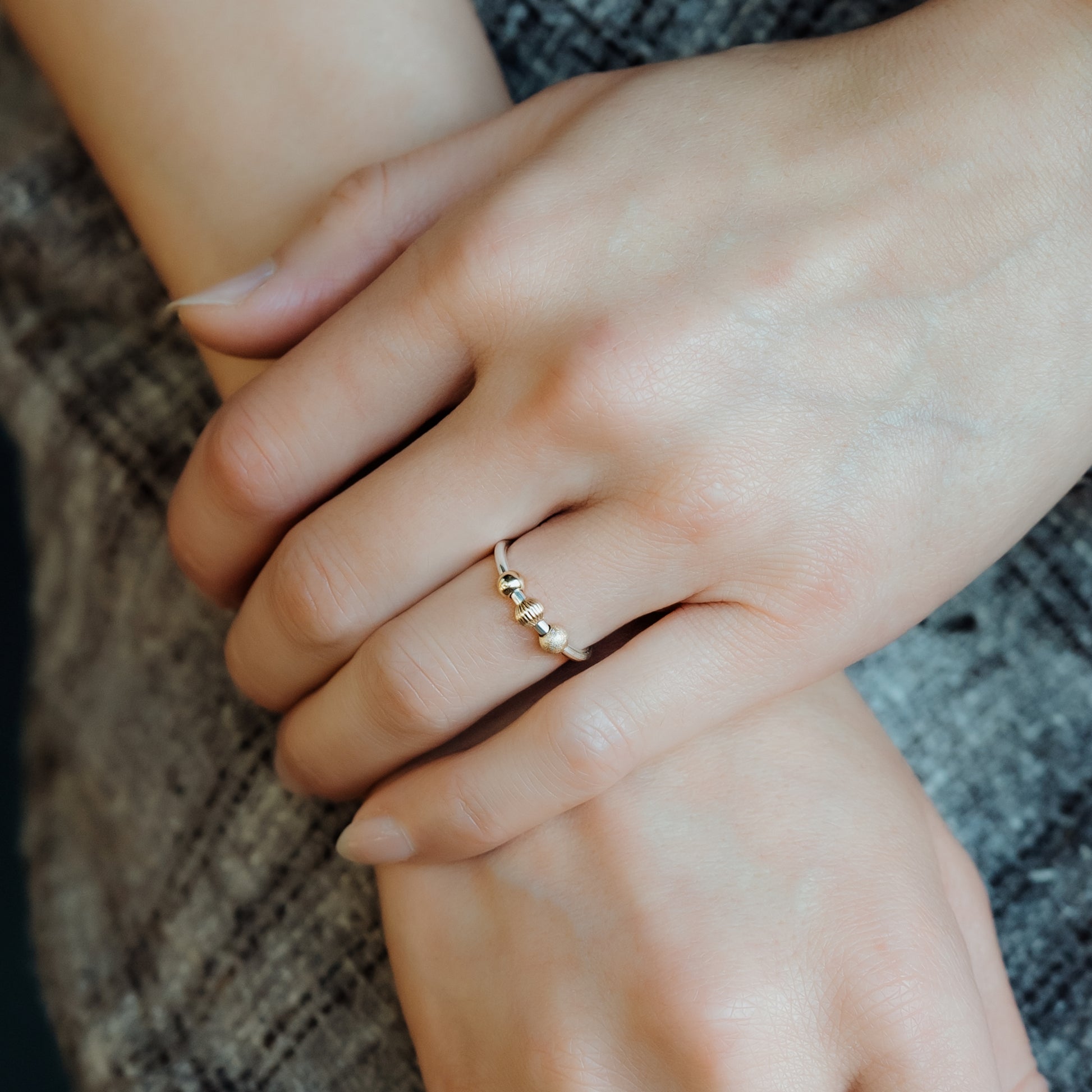 Woman wearing Gold and Silver Fidget Ring - Trisha Flanagan